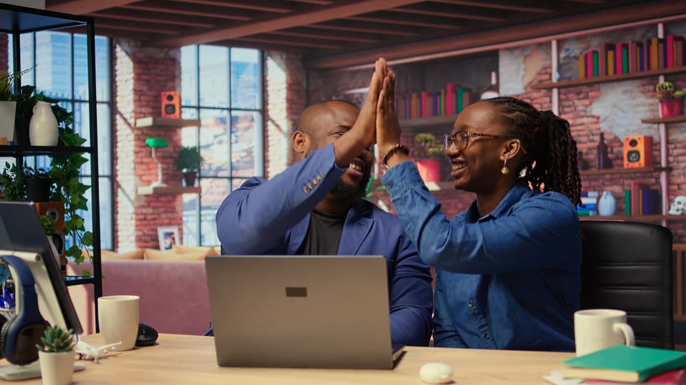 Colleagues celebrating a payment received